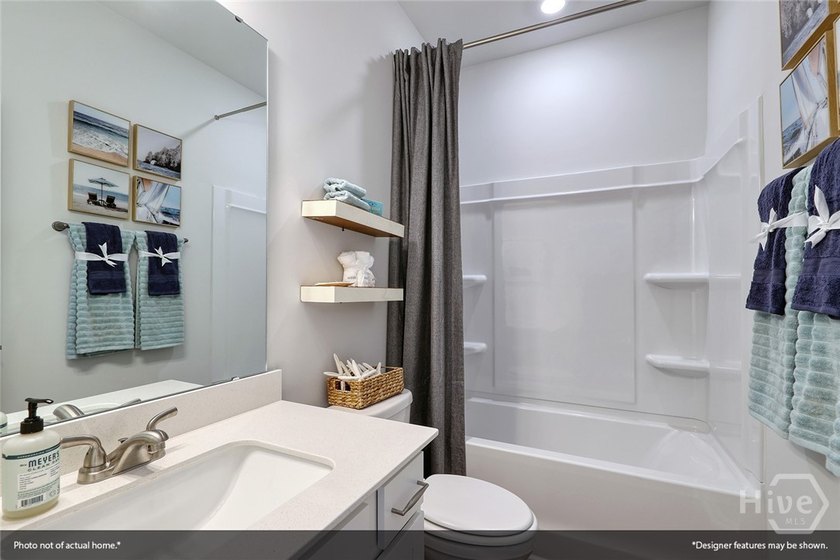 The Lawrence is a thoughtfully designed one-story home featuring - photo 3
