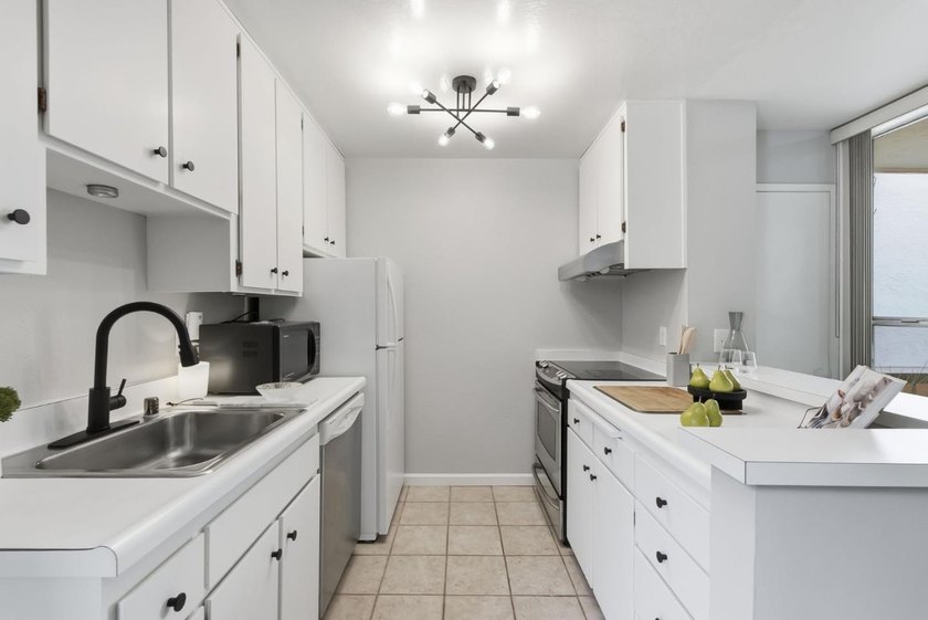 Welcome to 250 Whitmore Avenue, Unit 104, a bright and - photo 6