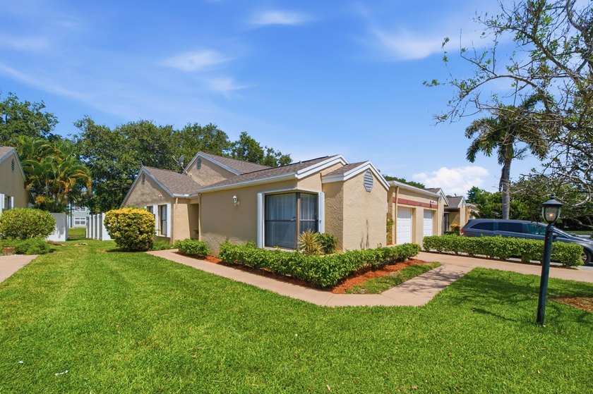 THIS STUNNING WATERFRONT CORNER HOME IN LAKESIDE GREEN IS THE - photo 2