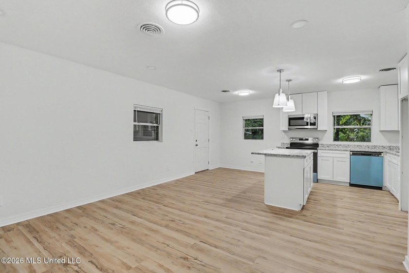 Completely renovated and move-in ready, this stunning 3-bedroom - photo 5