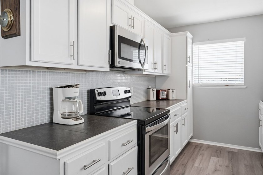 Nestled on two spacious lots in Holiday Beach, this fully - photo 13