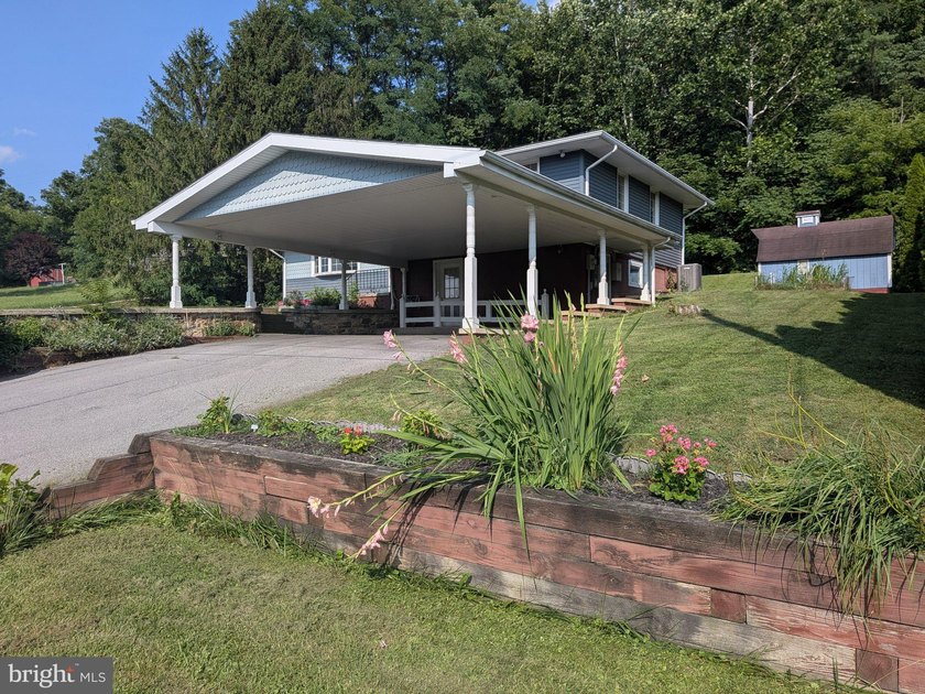 This charming split-level home, built in 1960, offers a perfect - photo 3