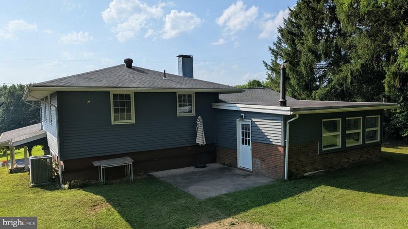This charming split-level home, built in 1960, offers a perfect - photo 8