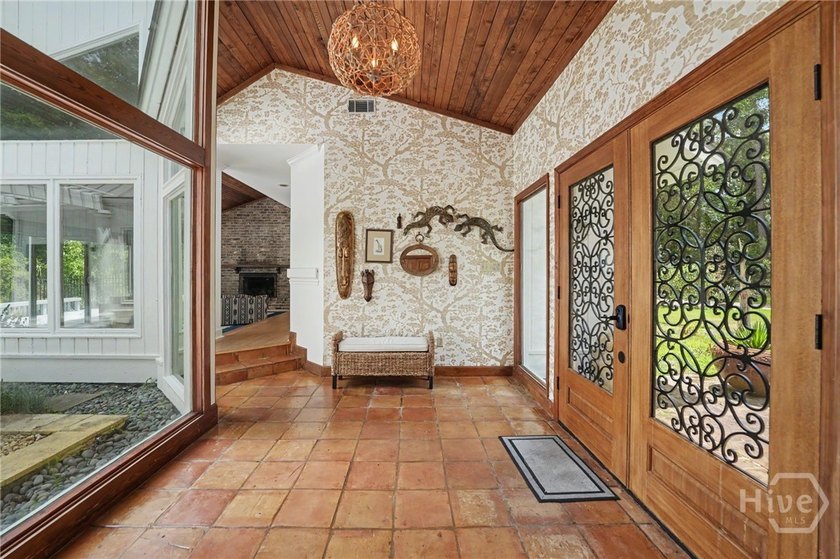 Set on a generous private lot at the end of a quiet street, this - photo 4