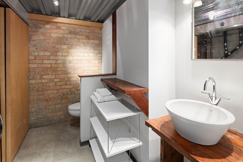 Located in the historic 801 lofts, this authentic loft offers a - photo 13