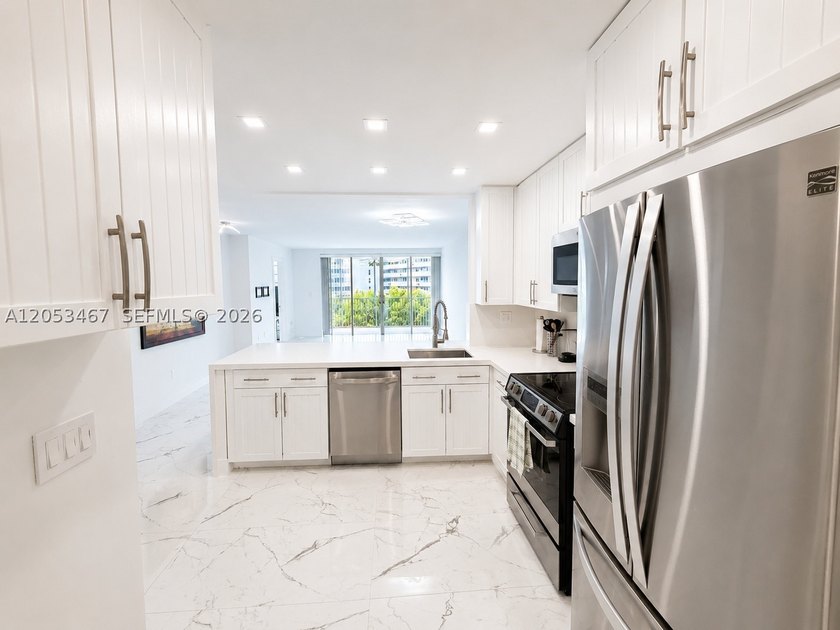 Beautifully remodeled 2-bedroom + den, 2-bath residence has the - photo 4