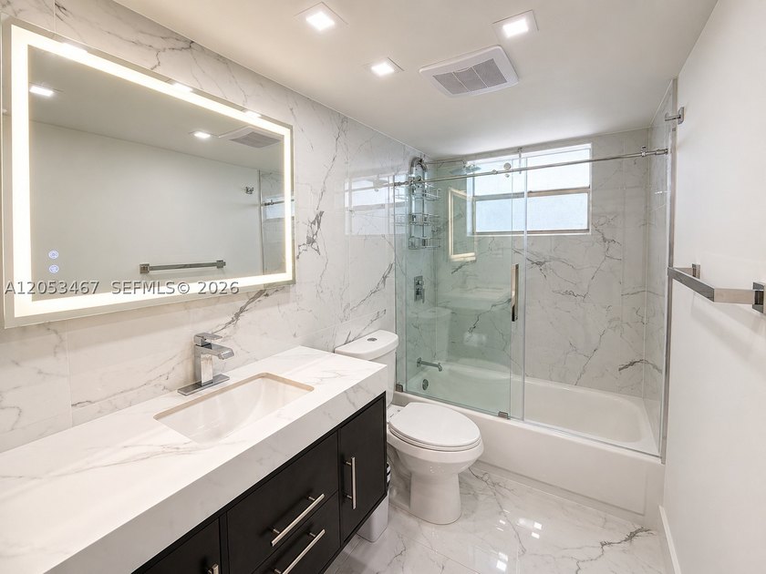 Beautifully remodeled 2-bedroom + den, 2-bath residence has the - photo 8