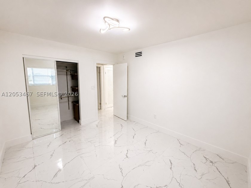Beautifully remodeled 2-bedroom + den, 2-bath residence has the - photo 10