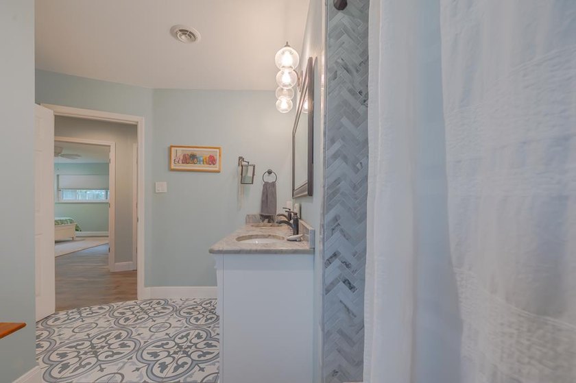 Welcome to this beautifully updated coastal rambler, where - photo 49