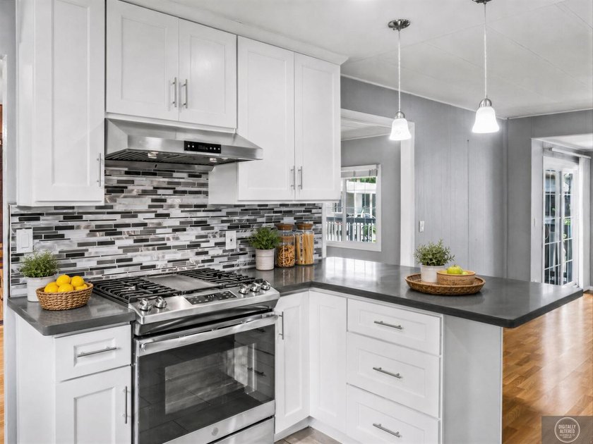 Welcome to this beautifully updated 3 bedroom, 2 bath residence - photo 8
