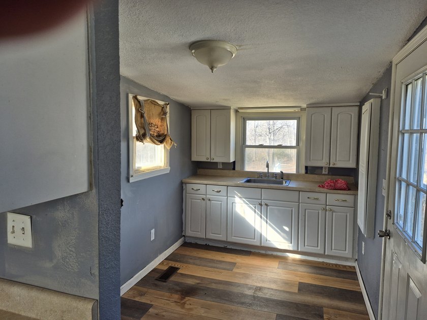 This small home with 4.45 acres is located in a great location - photo 4