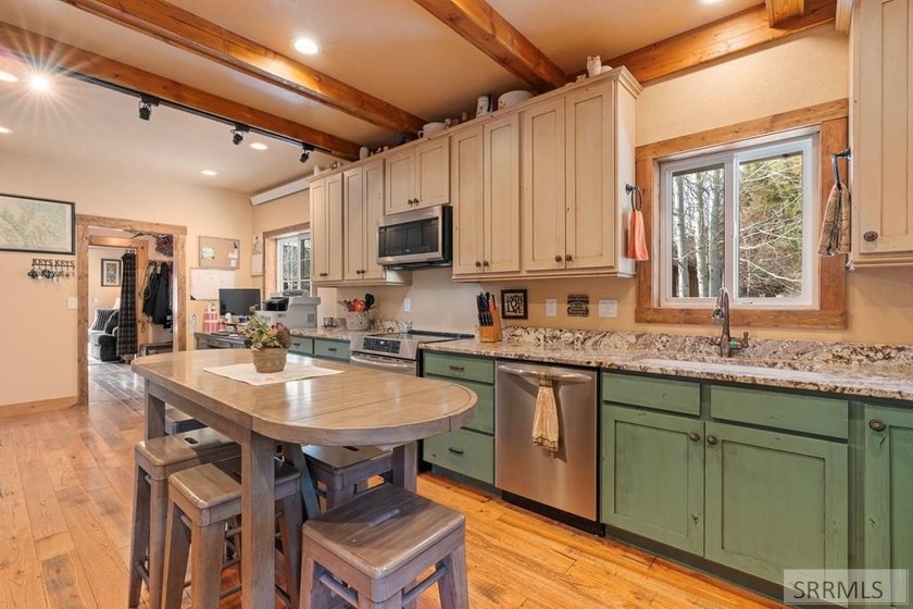 Set on 5 meticulously landscaped acres in breathtaking Swan - photo 27