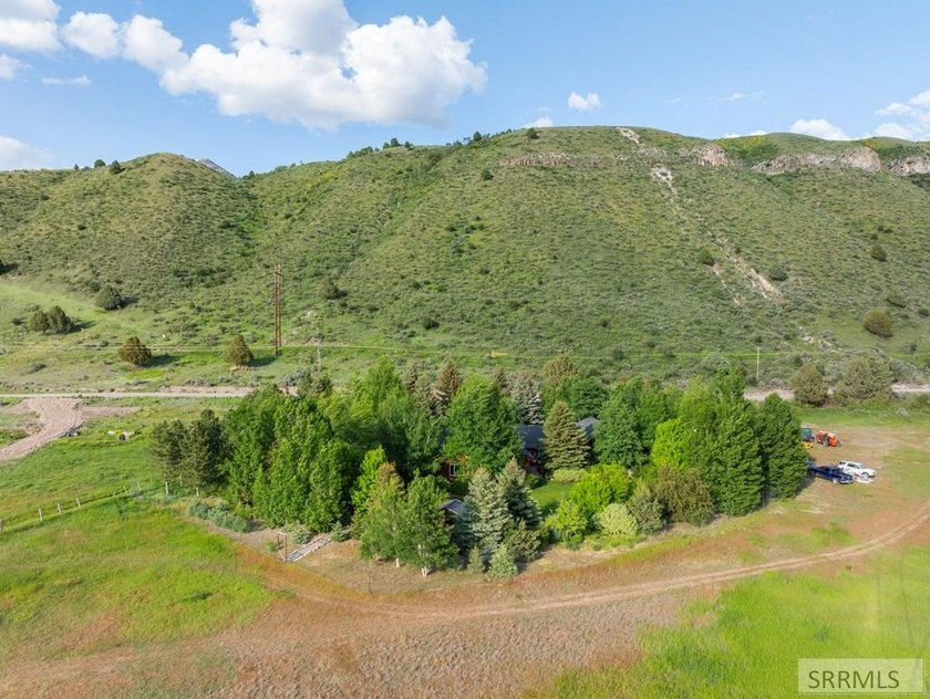 Set on 5 meticulously landscaped acres in breathtaking Swan - photo 36