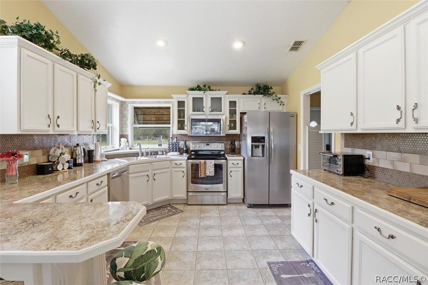 Welcome home to this inviting three-bedroom, two-bath with - photo 16