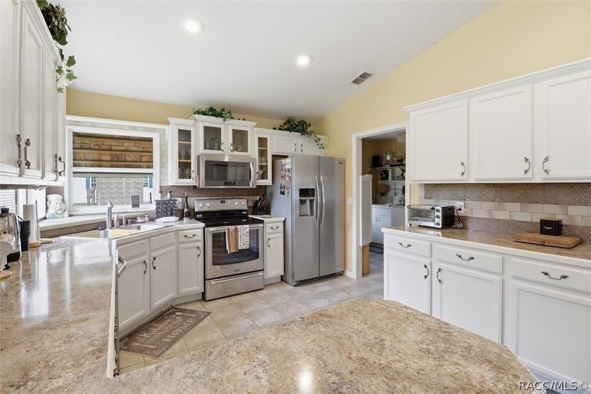 Welcome home to this inviting three-bedroom, two-bath with - photo 18
