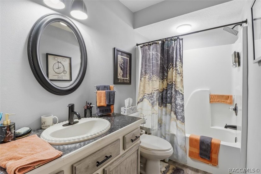 Welcome home to this inviting three-bedroom, two-bath with - photo 26