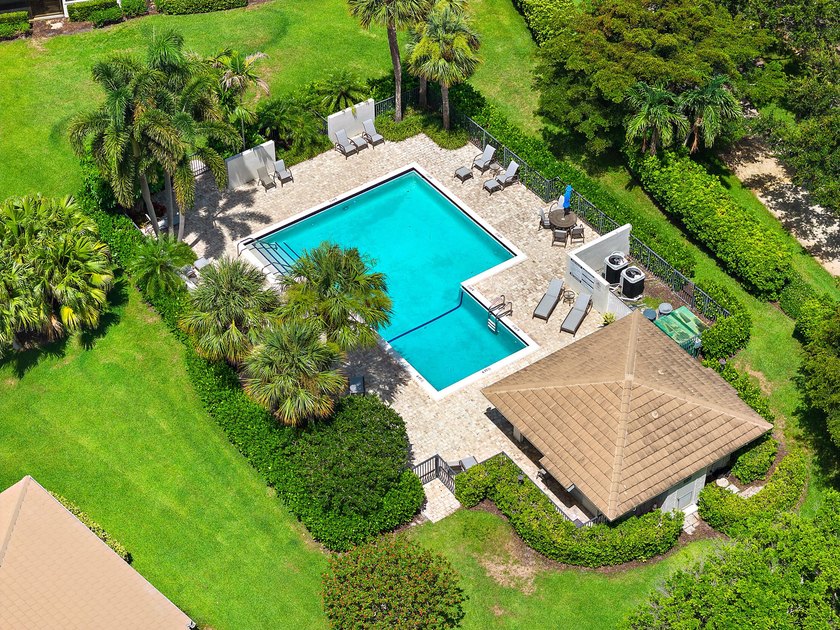 Tucked away in the picturesque Windward Village enclave of - photo 4