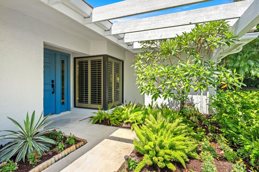 Tucked away in the picturesque Windward Village enclave of - photo 7
