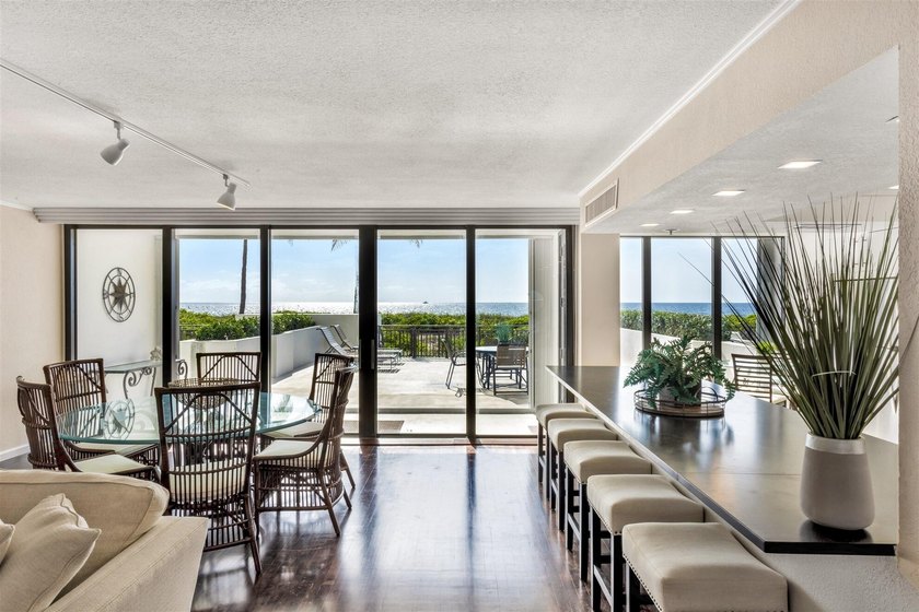 RARELY AVAILABLE BEACHFRONT VILLA OFFERING EFFORTLESS - photo 2