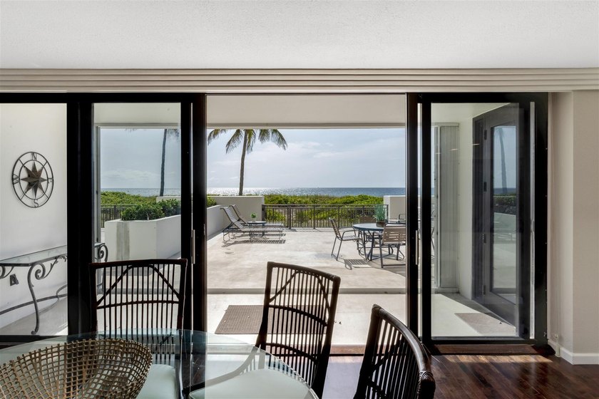 RARELY AVAILABLE BEACHFRONT VILLA OFFERING EFFORTLESS - photo 7