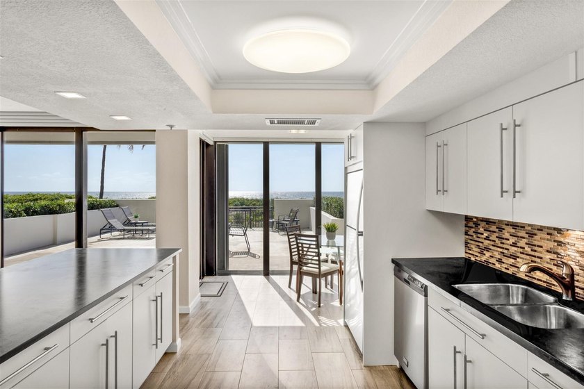 RARELY AVAILABLE BEACHFRONT VILLA OFFERING EFFORTLESS - photo 10