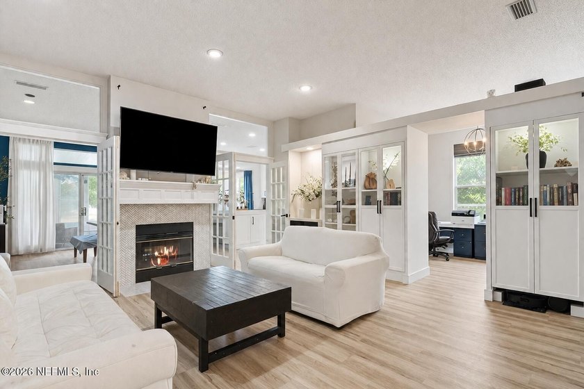 Set on a peaceful waterfront lot in the gated community of The - photo 3