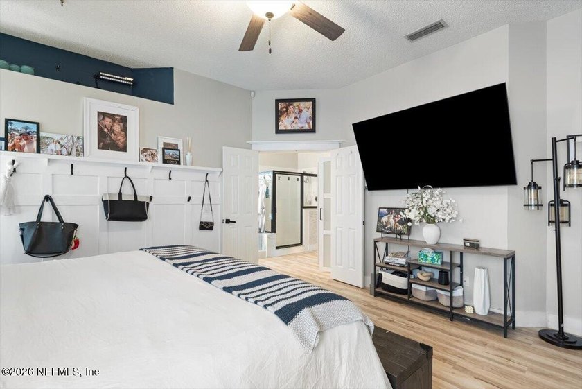 Set on a peaceful waterfront lot in the gated community of The - photo 5