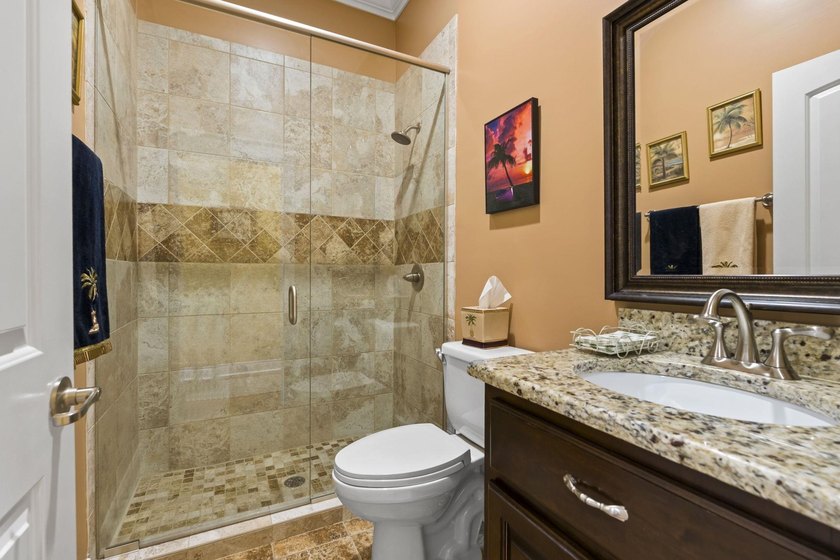 Four-bedroom, three-bathroom, elevated coastal home with a - photo 15