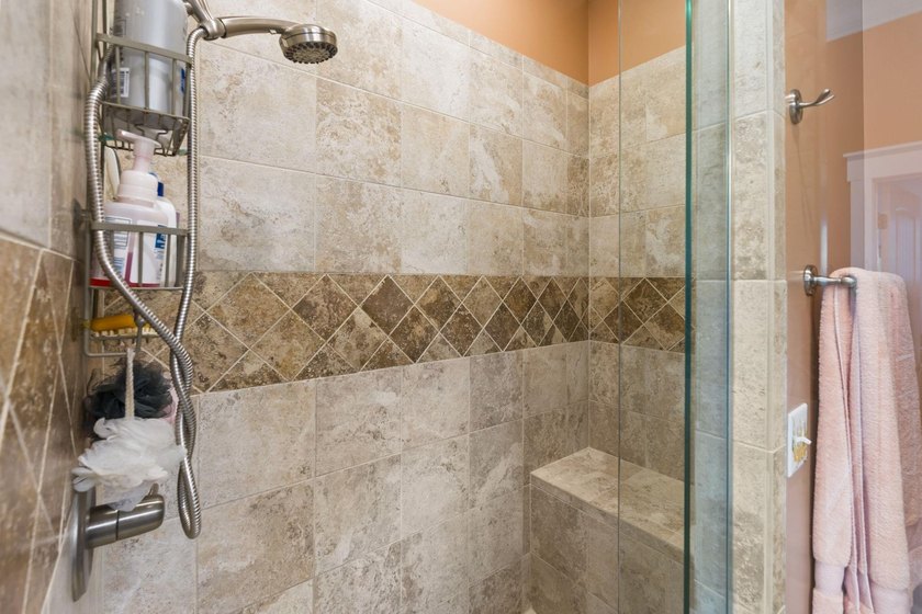 Four-bedroom, three-bathroom, elevated coastal home with a - photo 20