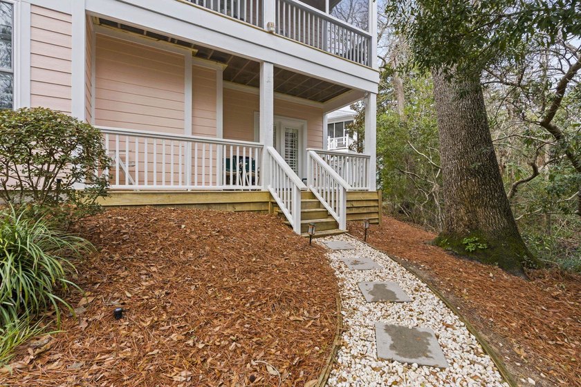 Four-bedroom, three-bathroom, elevated coastal home with a - photo 27