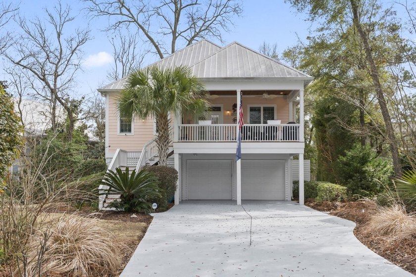 Four-bedroom, three-bathroom, elevated coastal home with a - photo 36
