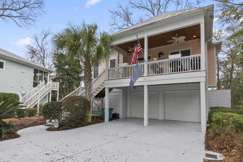 Four-bedroom, three-bathroom, elevated coastal home with a - photo 38
