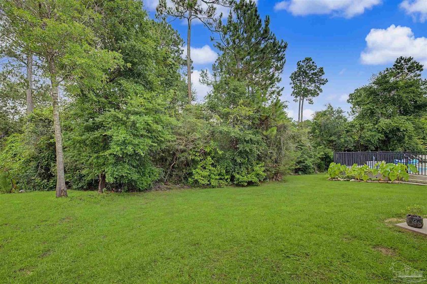 Discover this beautifully maintained home in Nature Trail. Backs - photo 40