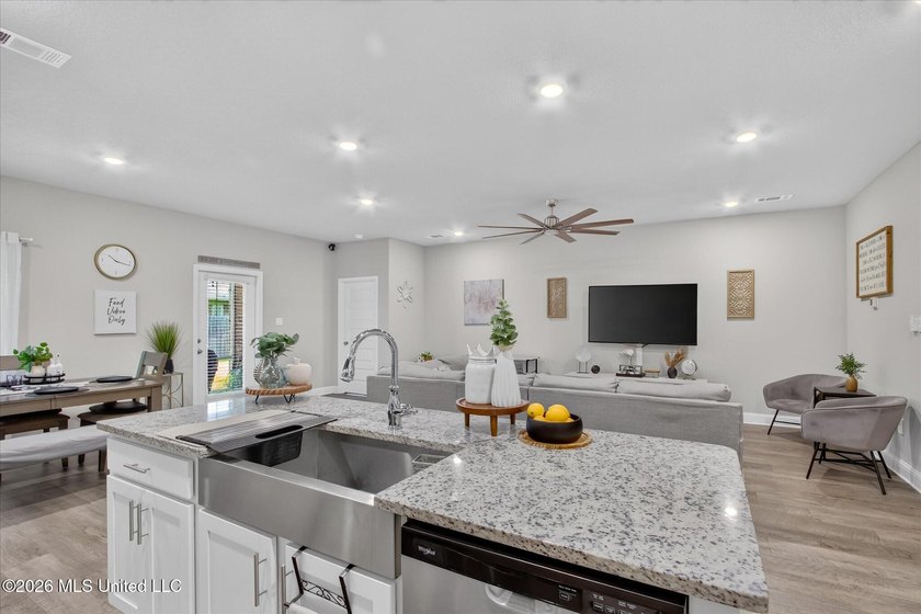 Some homes you tour. This one you settle into. The open layout - photo 2