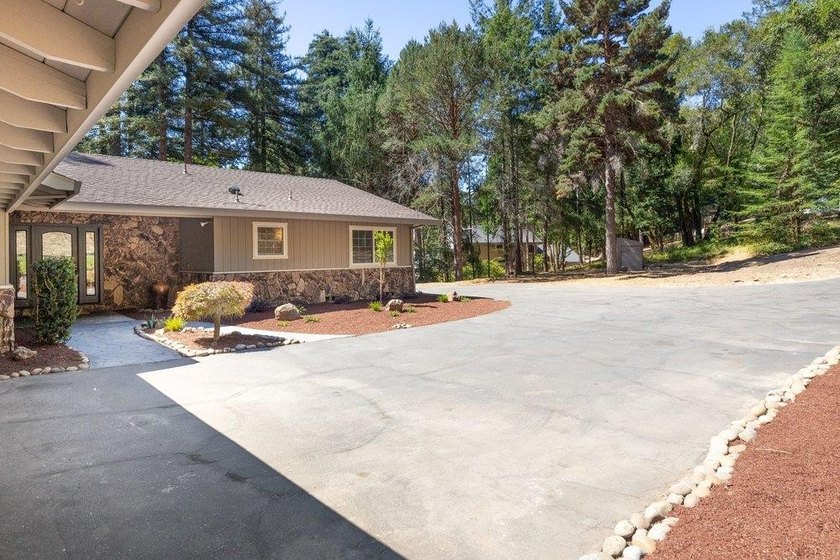 Nicely tucked back on approximately 2.8 peaceful acres in the - photo 3