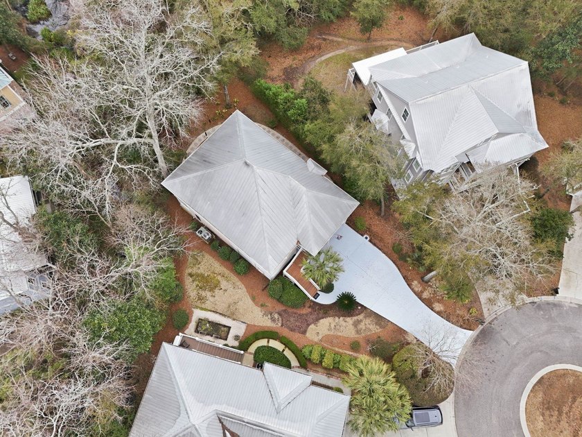 Four-bedroom, three-bathroom, elevated coastal home with a - photo 44
