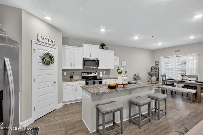 Some homes you tour. This one you settle into. The open layout - photo 7
