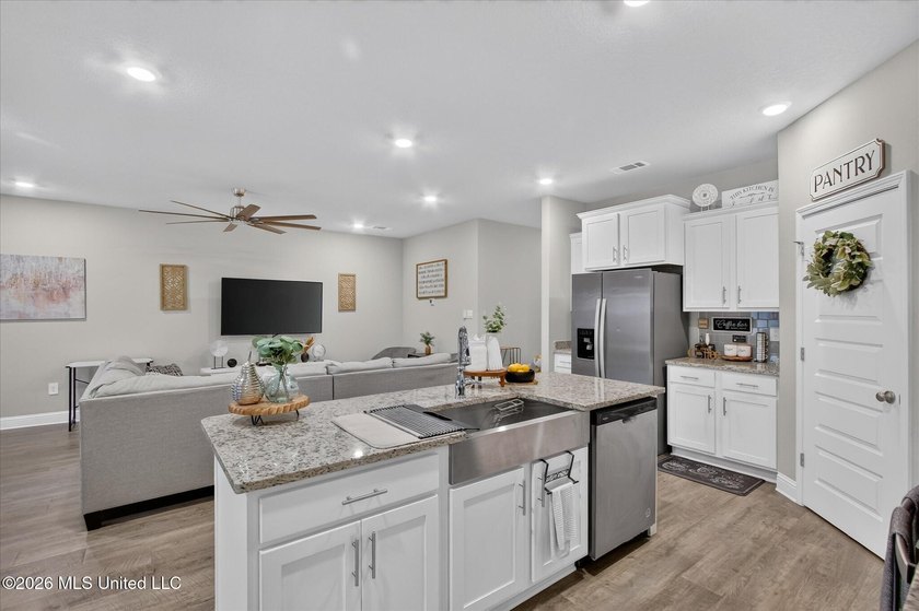 Some homes you tour. This one you settle into. The open layout - photo 8