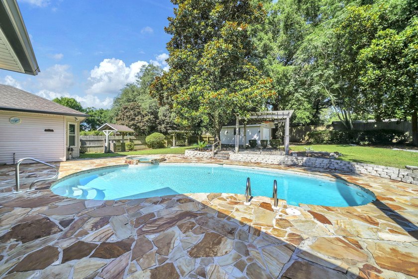 Rarely available in Niceville, this single-level pool and spa - photo 50