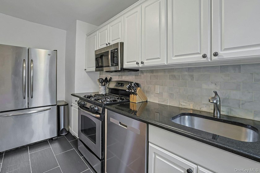 Located in the well-established Wykagyl Gardens community, this - photo 14