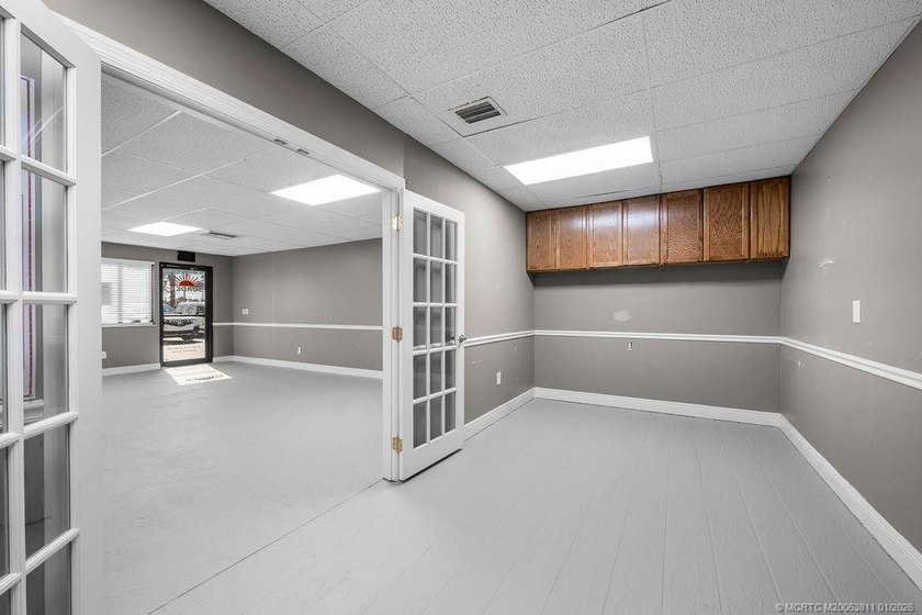 Bright, open showroom with newly applied SunDek finished floors - photo 4