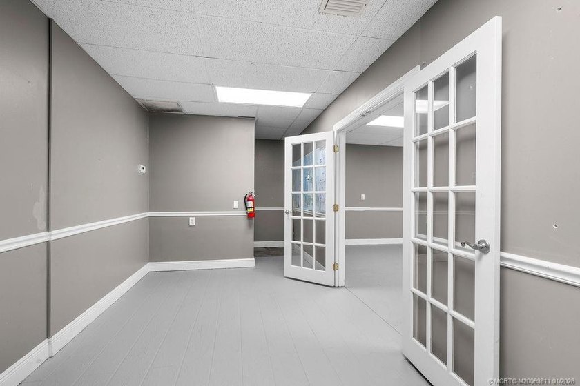 Bright, open showroom with newly applied SunDek finished floors - photo 5