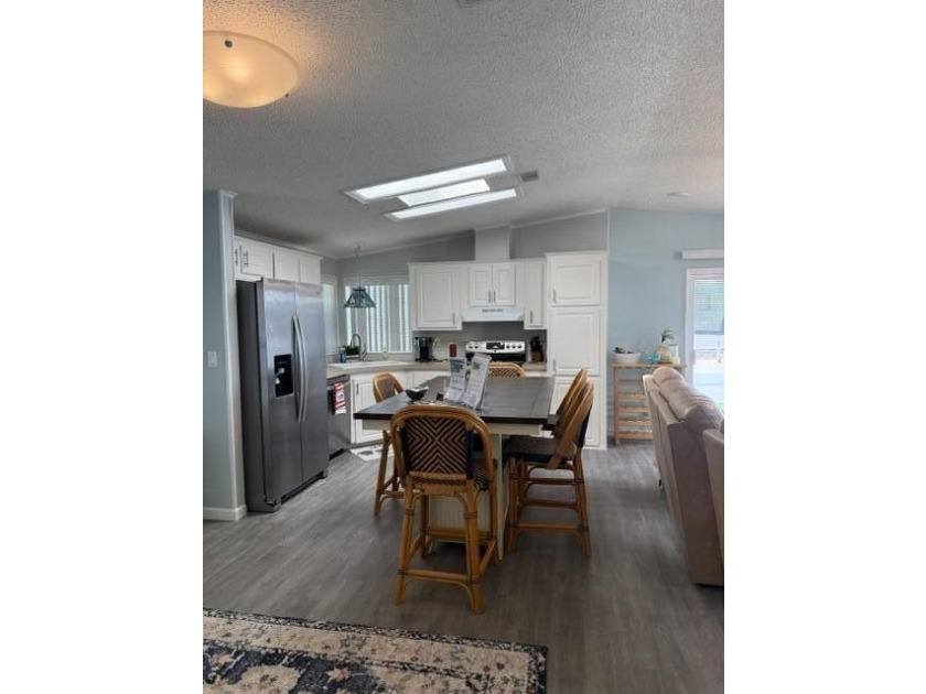 Welcome to this charming 2-bedroom, 2-bathroom residence located - photo 4