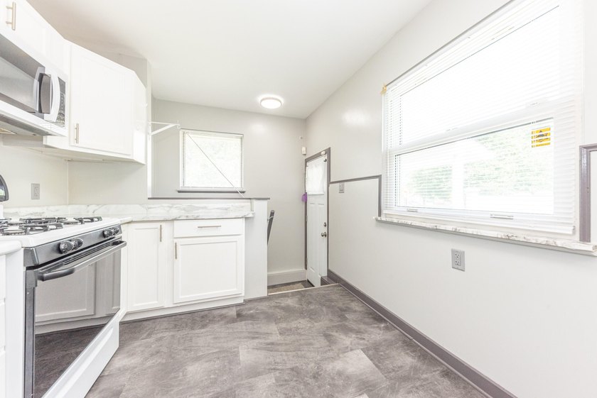 Quiet tree lined street this 3BR/2BA ranch home is located in a - photo 12