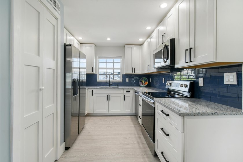 Experience waterfront living in this beautifully updated - photo 7