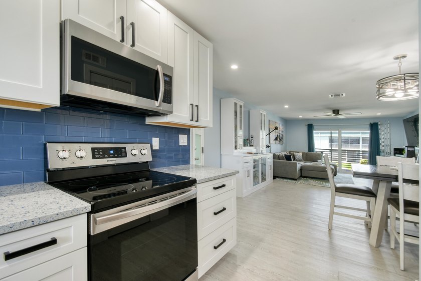 Experience waterfront living in this beautifully updated - photo 8