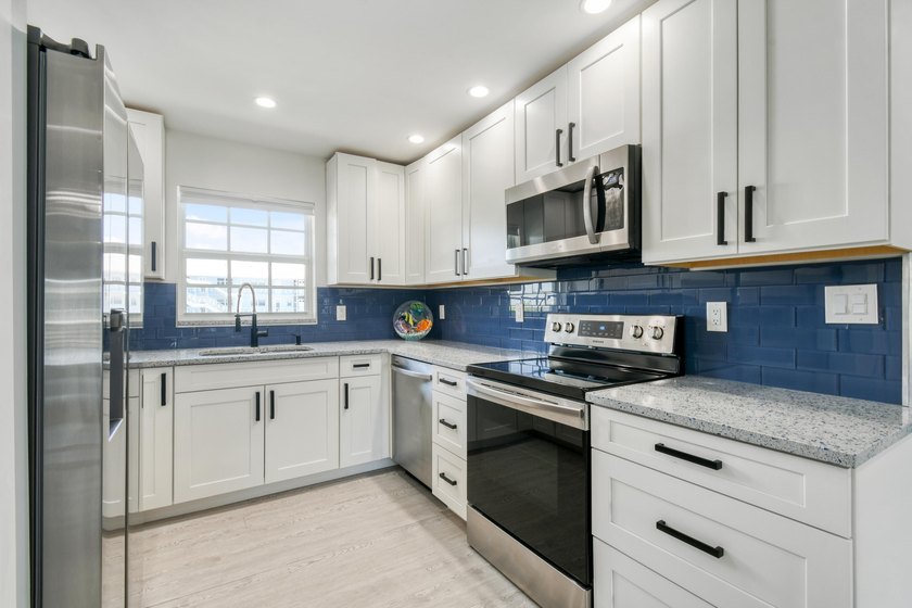 Experience waterfront living in this beautifully updated - photo 9