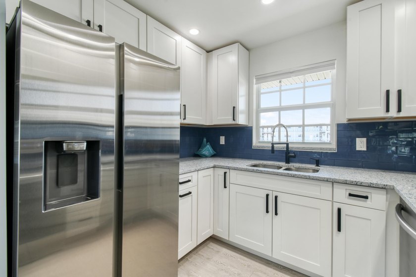 Experience waterfront living in this beautifully updated - photo 10