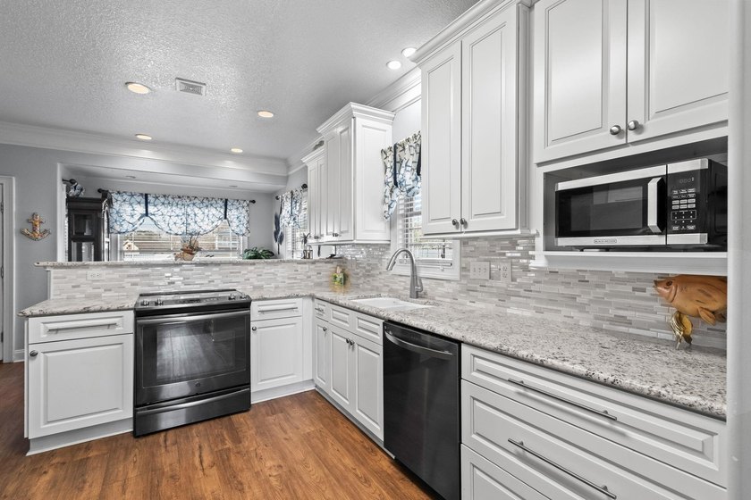 CUSTOM BUILT OCEAN VIEW RAISED BEACH HOUSE WITH HUGE WRAPAROUND - photo 32
