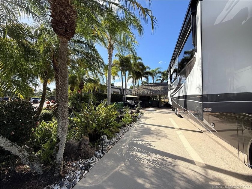 Located on the large lake with double fountains, this is truly - photo 4